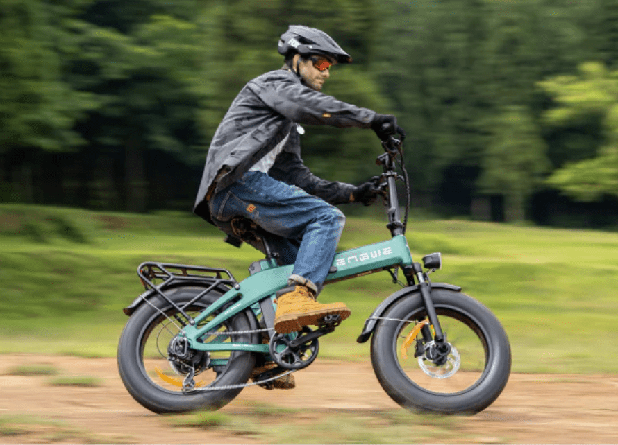 Man riding the ENGWE EP-2 3.0 Boost folding fat-tyre e-bike in a park