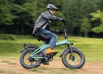 Man riding the ENGWE EP-2 3.0 Boost folding fat-tyre e-bike in a park