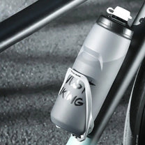 Bottle holder for e-bike frames holding a bottle
