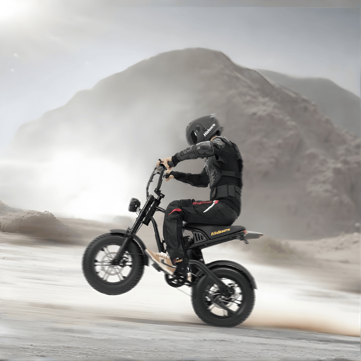 Man riding the Hidoes B6 Mini fat-tyre e-bike on sandy ground
