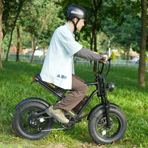 Man riding the Hidoes B6 Mini fat-tyre e-bike in a park