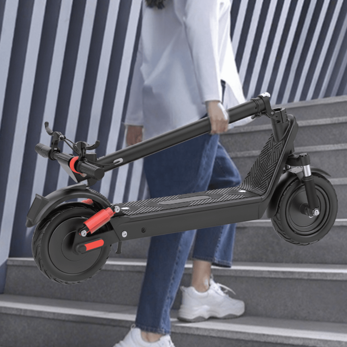 Person walking with the HX X9B electric scooter in the city