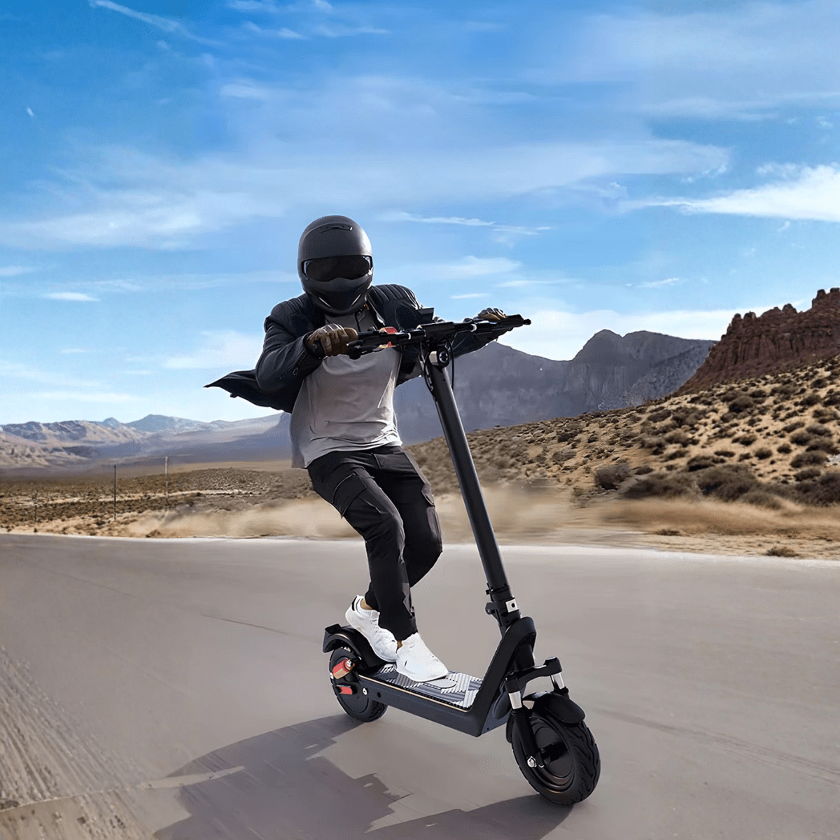 Person riding the HX X9B electric scooter on a road