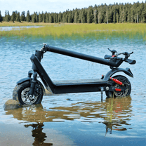HX X9B electric scooter folded by a lake