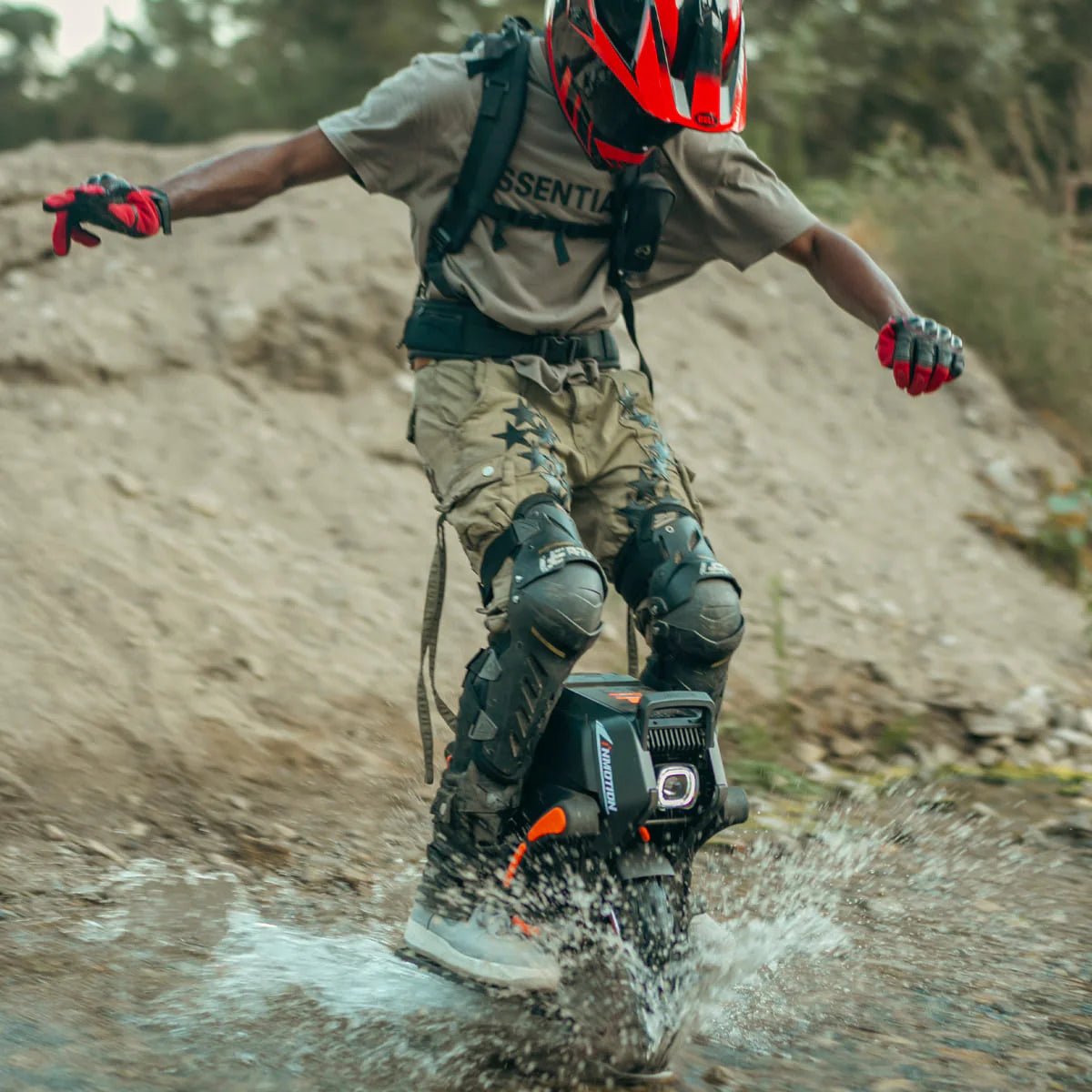 Person riding the InMotion V14 Adventure electric unicycle on a trail