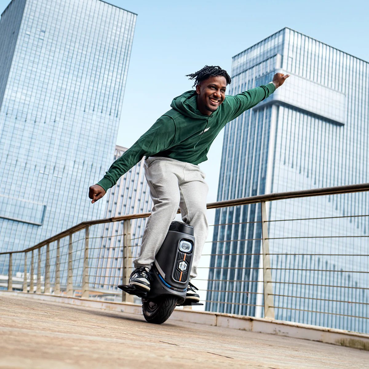 Man riding the InMotion V9 electric unicycle in the city