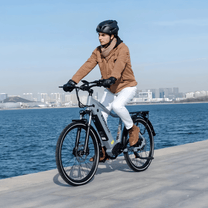 Man riding the KOOLUX X3 e-bike by the sea