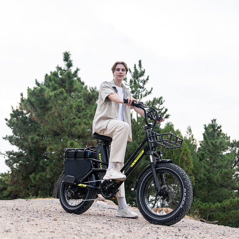 Man riding the KOOLUX X8 fat-tyre e-bike on a footpath