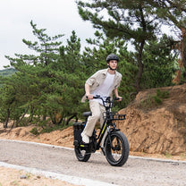 Man riding the KOOLUX X8 fat-tyre e-bike on a footpath