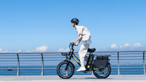 Man riding the KOOLUX X8 fat-tyre e-bike by the sea