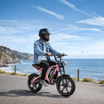 Person riding the KOOLUX X9 Mini fat-tyre e-bike by the sea