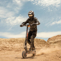 Rider taking the KuKirin G2 Ultra electric scooter off-road