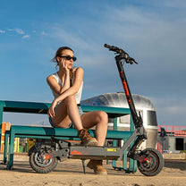 Woman standing with the KuKirin G2 Ultra electric scooter