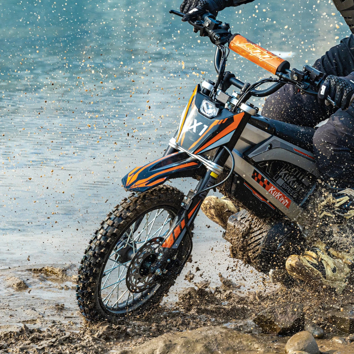 Rider taking the KuKirin X1 electric dirt bike off-road