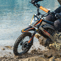 Rider taking the KuKirin X1 electric dirt bike off-road