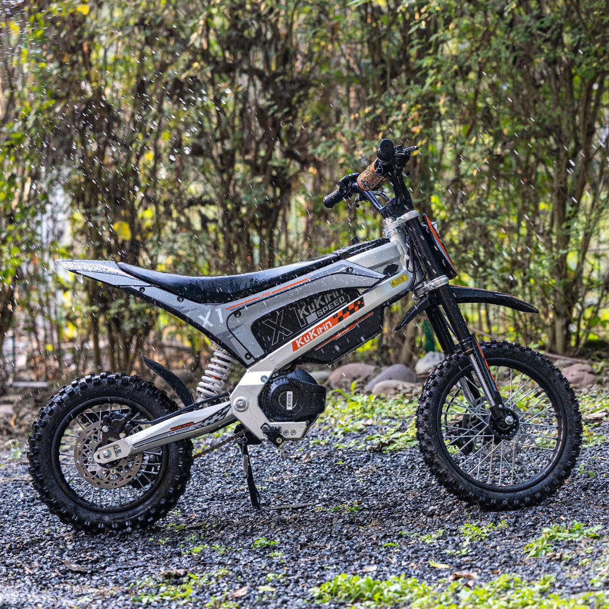 KuKirin X1 electric dirt bike seen from the side in the forest