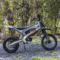 KuKirin X1 electric dirt bike seen from the side in the forest