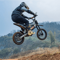 Rider jumping with the KuKirin X1 electric dirt bike