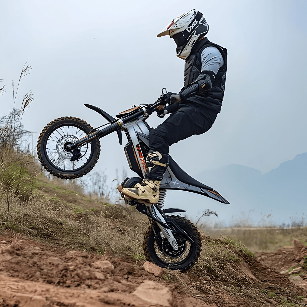 Rider jumping with the KuKirin X1 electric dirt bike in the mountains