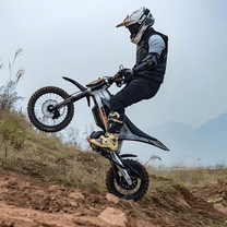 Rider jumping with the KuKirin X1 electric dirt bike in the mountains