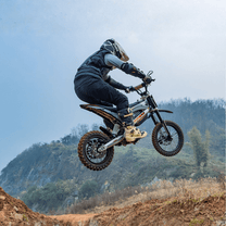 Rider jumping with the KuKirin X1 electric dirt bike