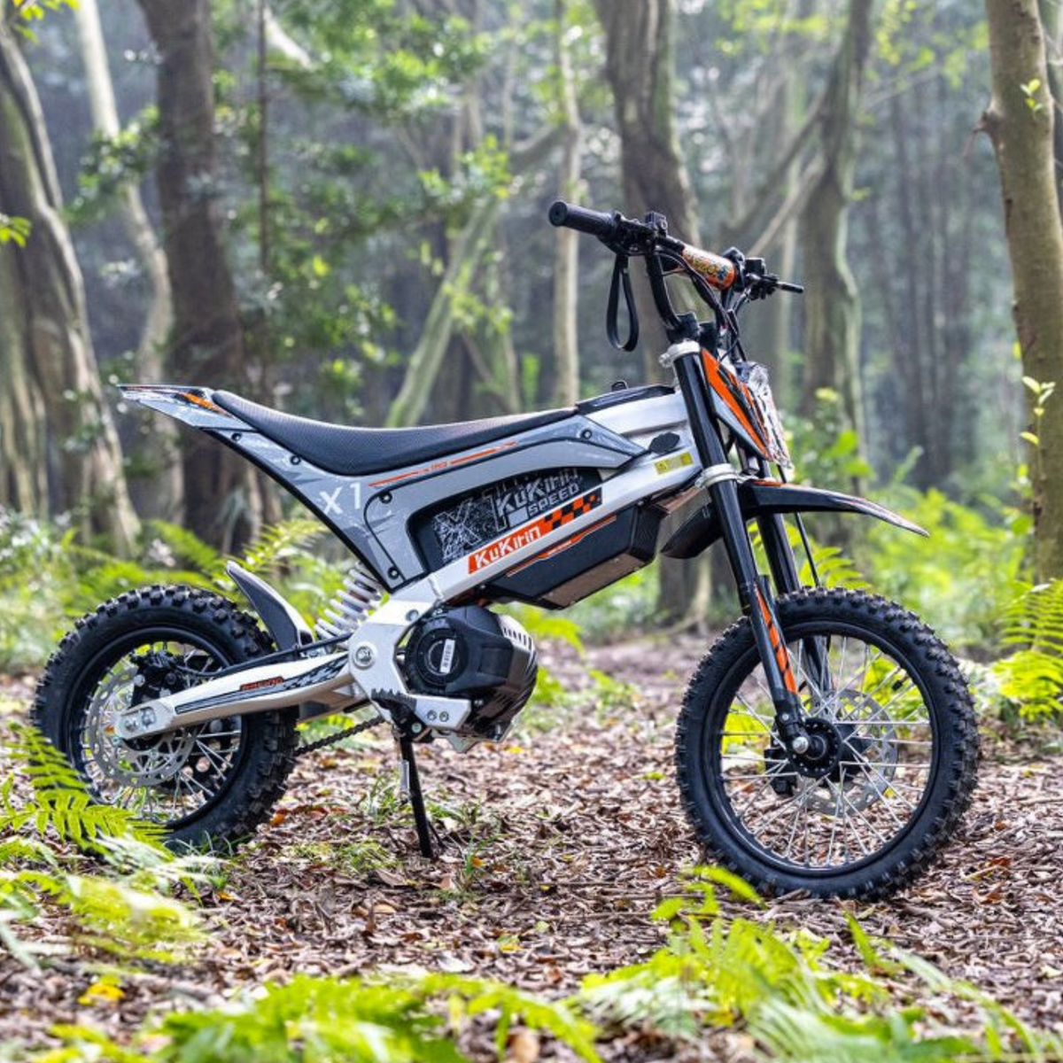 KuKirin X1 electric dirt bike seen from the side in the forest