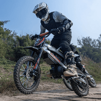Rider taking the KuKirin X1 electric dirt bike off-road