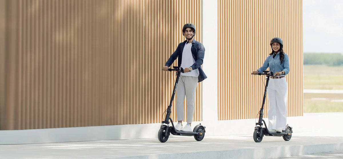 Person riding the NAVEE V25i Pro II electric scooter in the city