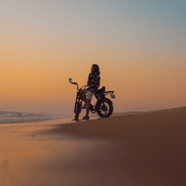 Person riding the Onemile P40 Pro fat-tyre e-bike at sunset