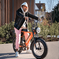 Person standing with the Onemile P40 Pro fat-tyre e-bike on a street