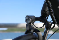 OneSport OT12 headlight in black by the sea