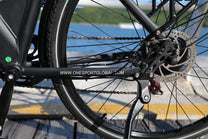 OneSport OT12 cranks and pedals in black by the sea