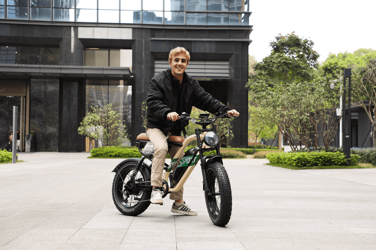 Man riding the OneSport W66 fat-tyre e-bike on a street