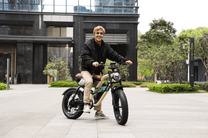 Man riding the OneSport W66 fat-tyre e-bike on a street