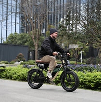Man riding the OneSport W66 fat-tyre e-bike in the city