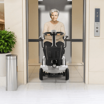 Older woman sitting in the SEEDREAM S-02 mobility scooter indoors