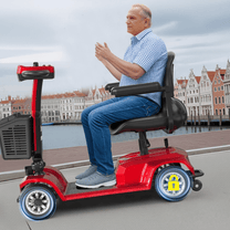Older man sitting in the SEEDREAM X-02 mobility scooter in the city