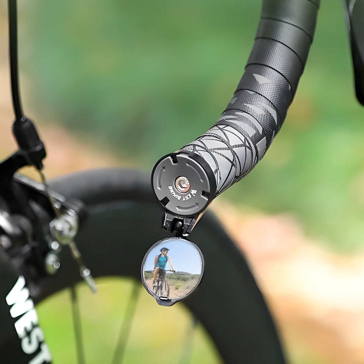 Close-up of smart rear-view mirror Mini on the bicycle handlebar