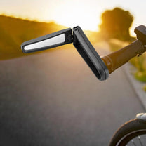 Smart foldable rear-view mirror on a bicycle outdoors