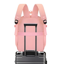 Smart backpack Splash Edition in pink on a suitcase handle