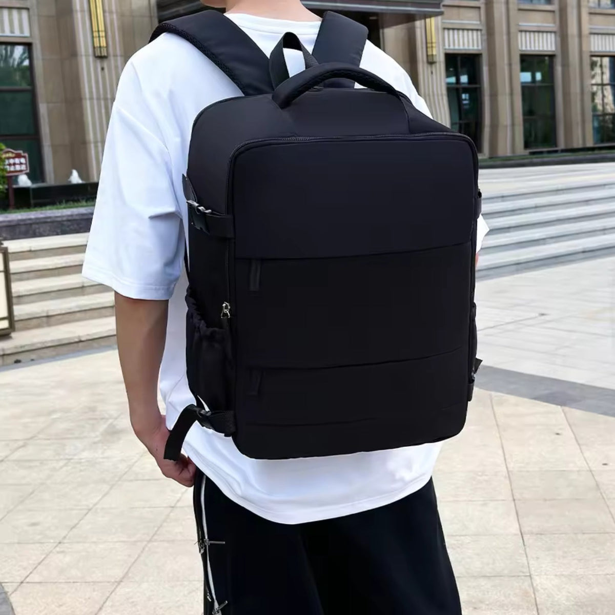 Smart backpack Splash Edition in black, worn by a person, front view