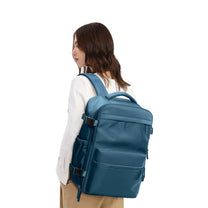 Smart backpack Vacuum Edition in blue, worn by a person, rear view
