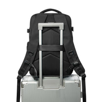 Smart backpack Vacuum Edition in black on a suitcase handle