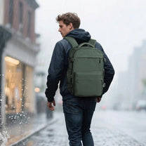 Person walking in town with smart backpack Vacuum Edition in green