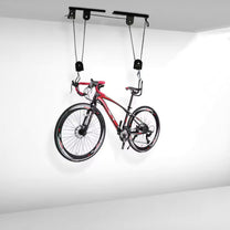 Smart bike ceiling mount with a bike on the ceiling, side view