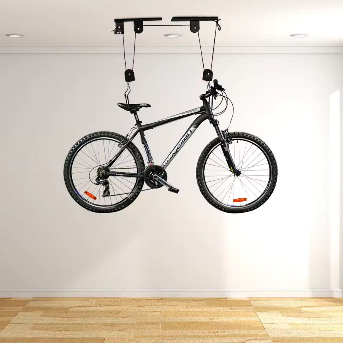 Smart bike ceiling mount with a bike on the ceiling in a room