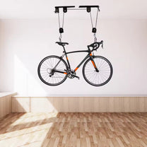 Smart bike ceiling mount with a bike on the ceiling, angled view
