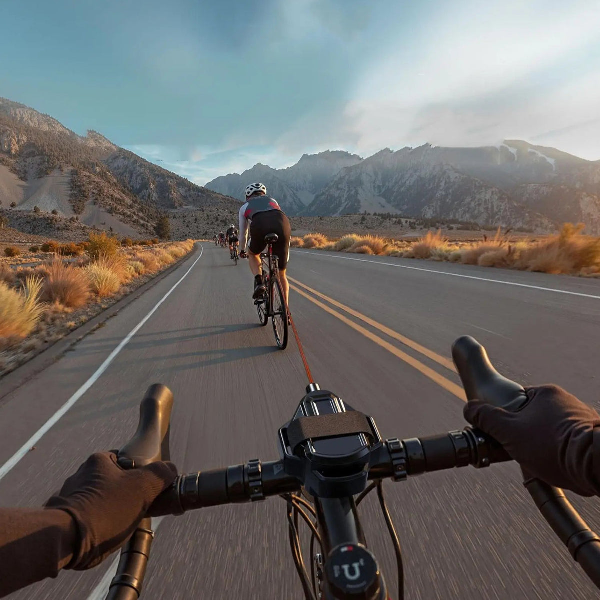 Smart retractable bike tow rope with hook towing a bicycle, from the rider’s point of view