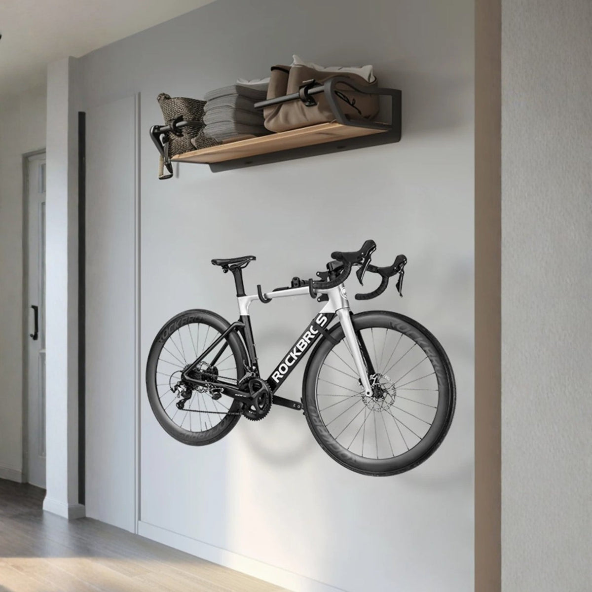 Smart bike wall mount with a bike on the wall in a hallway