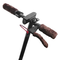 Smart warm-lined handlebar covers in brown fitted on the electric scooter